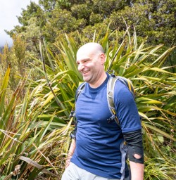 2. Happy guest walking the Routeburn Track