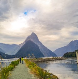 2. Milford Sound warf bright sky breaking through cloud