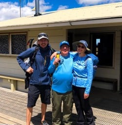 Guide Age and couple at hut in Tongariro National Park