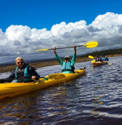 3 Happy guests on west coast kayaking