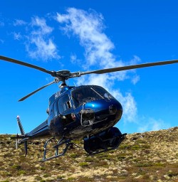 Helicopter landing at Luxmore Hut