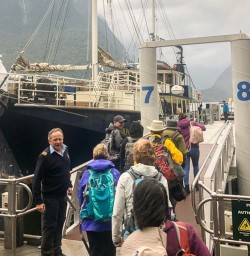 Boarding on the boat at Milford Sound, Fiordland New Zealand
