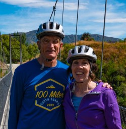 Couple on bridge Arrowtown bike ride