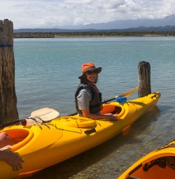 Couple ready to kayak at Okarito Lagoon, West Coast New Zealand