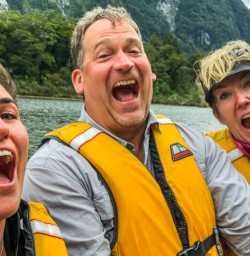 Group in the boat at Arthur river, Fiordland New Zealand