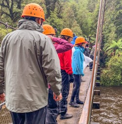 Group on the bridge at Nile River, West Coast New Zealand