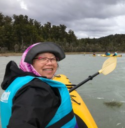 Guest kayaking at Okarito Lagoon, West Coast New Zealand
