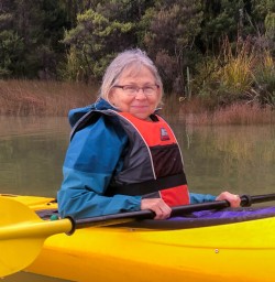 Guest kayaking at Okarito Lagoon, West Coast New Zealand