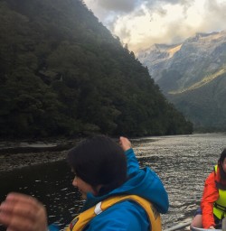 Guide on the boat at Arthur river, Fiordland New Zealand