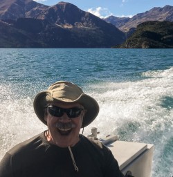Happy guest on the boat at Lake Wanaka, Otago New Zealand