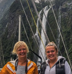 Ladies at Stirling Falls at Milford Sound, Fiordland National Park Southland New Zealand