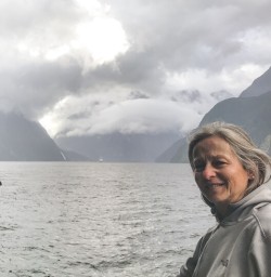 Lady on the boat at Milford Sound, Fiordland New Zealand
