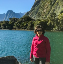 Lady at Milford Sound, Fiordland National Park Southland New Zealand