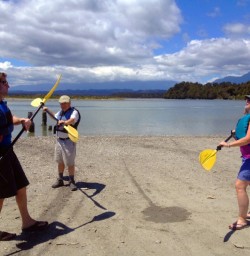 practicing kayaking at okarito lagoon