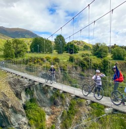3. Guests crossing bridge Arrowtown bike trip