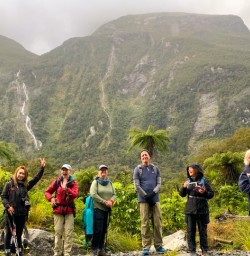 3. Guests on Milford Track under waterfalls