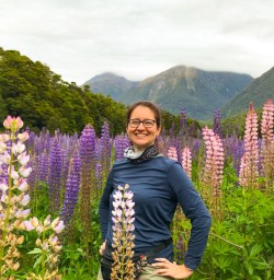 Solo guest smiling in lupin field copy