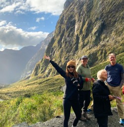 3.5 Guests driving out of Milford Sound at sunset