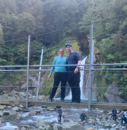 3. Two happy guests at falls on Milford Track