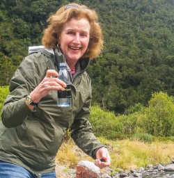 Drinking water from river at Fiordland National Park, New Zealand