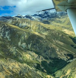 Flying through Fiordland mountains