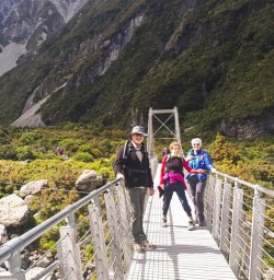 Group on the bridge at Hooker Valley Track, Canterbury New Zealand