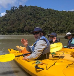 Group ready to kayak at Okarito Lagoon, West Coast New Zealand