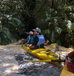 Happy kayakers at Okarito Lagoon, West Coast New Zealand