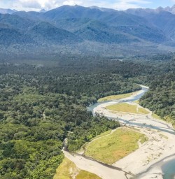 Helicopter Landing at Hollyford Valley, Fiordland National Park Southland New Zealand