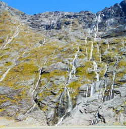 Incredible waterfalls on the sheer walls of the Homer Pass along the Milford Road