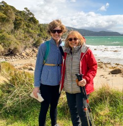 4. Two guests on Stewart Island beach