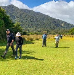 4. Guests hiking to Martins Bay
