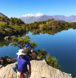 4. Guests taking in reflections on Mou Waho Island