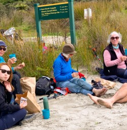4. Guide and guests on Stewart Island beach