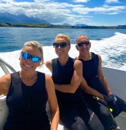 4. Three happy guests Dolphin swim boat ride