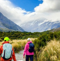 4. Two guests walking Hooker Valley Track