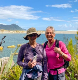 4. Two happy guests Martins Bay hike lookout