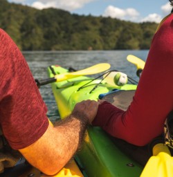 5 Guests holding hands on Kayak Tour copy
