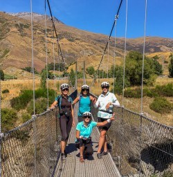 Biking group on the bridge at the Queenstown Trail, Otago New Zealand