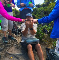 Chris from Ecotours Wanaka introducing us to some rare Geckos at Mou Waho Island sanctuary in Lake Wanaka