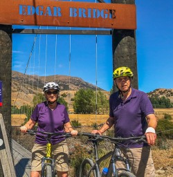 Couple riding the Arrow River Bridges Ride, Otago New Zealand