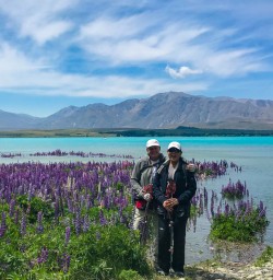 Couple enjoying Lake Tekapo lupins