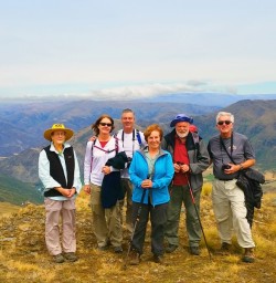 hikers on the crown range queenstown new zealand
