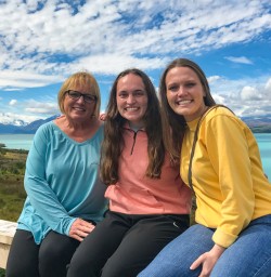 Family on Lake Pukaki's shores