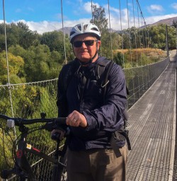 Guest biking the Arrow river Bridges Ride, Otago New Zealand