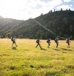 5. Nydia Track Guests walking across field