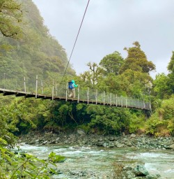 5. Solo guest crossing swing bridge at hidden falls