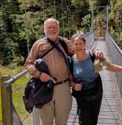 Couple on the bridge at Routeburn track, Otago New Zealand