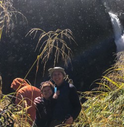 Couple at Hidden Falls, Hollyford Track Fiordland New Zealand