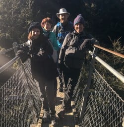 Group on the bridge at Routeburn track, Otago New Zealand